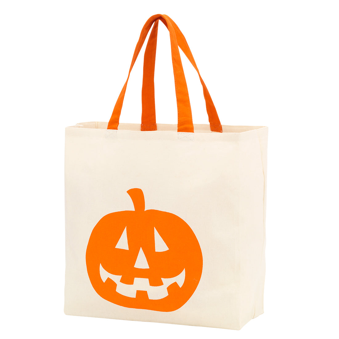 Cream canvas tote with a solid orange jack o lantern face and orange handles, three quarter view on white