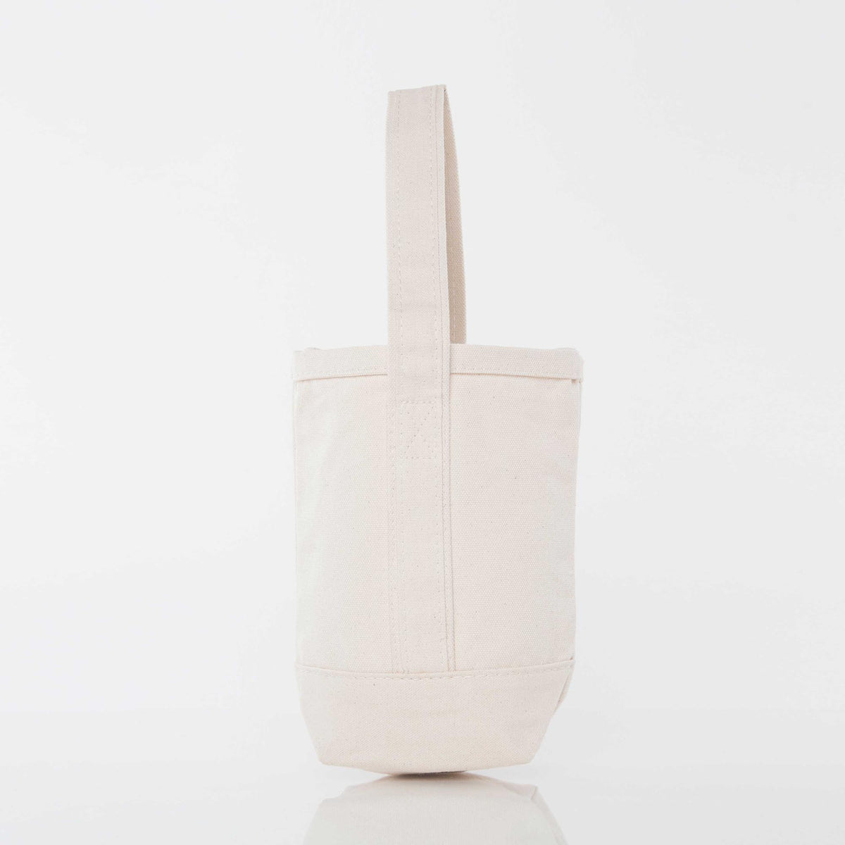 Plain natural canvas wine tote bag shown from the back, cream colored with a single handle, no visible monogram or embroidery on this side