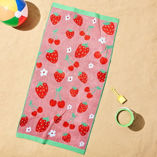Personalized Strawberry Kids Beach Towel 30 x 60 in, flat product view with beach toys