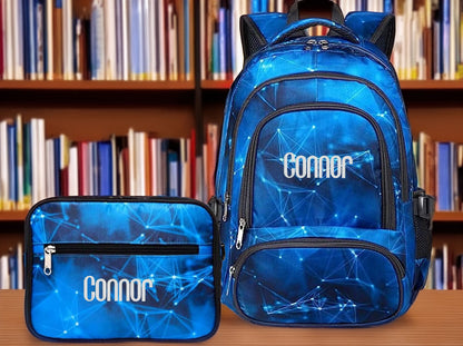 Blue backpack and lunchbox set with a constellation pattern and the name Connor embroidered in white.