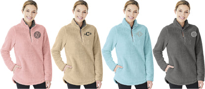 Four women modeling Charles River Newport fleece pullovers in pink, tan, light blue, and gray, each with a monogram.