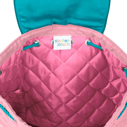Pink quilted diamond-pattern backpack interior with teal drawstrings, metal grommets, and white Stephen Joseph brand label sewn at top opening