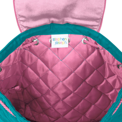 Pink quilted diamond-pattern backpack interior with teal trim, silver grommets, and white Stephen Joseph brand label sewn inside