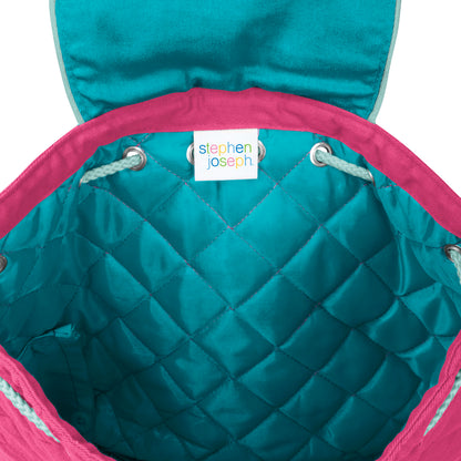 Teal quilted interior of a pink Stephen Joseph backpack with white drawstrings and a colorful Stephen Joseph brand label sewn inside the opening