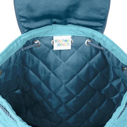Teal quilted Stephen Joseph backpack interior with diamond stitching, drawstring closure, and white brand label sewn inside the opening