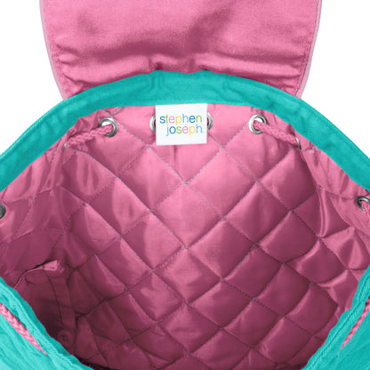 Pink quilted diamond-pattern Stephen Joseph backpack interior with teal drawstring rim and white brand label sewn inside the opening