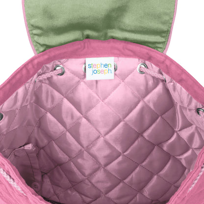 Pink quilted Stephen Joseph backpack interior with drawstring closure, green flap lining, and colorful brand label stitched inside