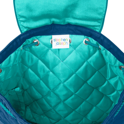 Teal quilted diamond-pattern backpack interior with blue trim, silver grommets, and white Stephen Joseph brand label sewn inside the opening