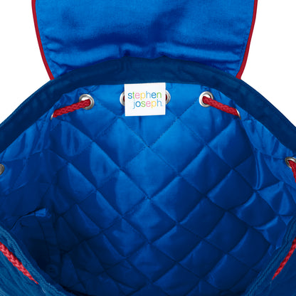 Open blue quilted backpack interior showing diamond stitching, red drawstrings, metal grommets, and white Stephen Joseph brand label sewn inside
