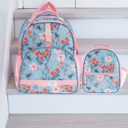 Stephen Joseph Bee All Over Print Backpack set in blue with pink trim, floral bee pattern, personalized with embroidered name "Adalyn" on both bags