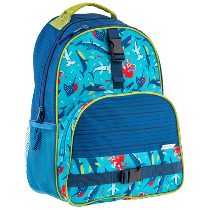 Blue Stephen Joseph backpack with shark all-over print, striped front pocket, mesh side pocket, and lime green trim accents