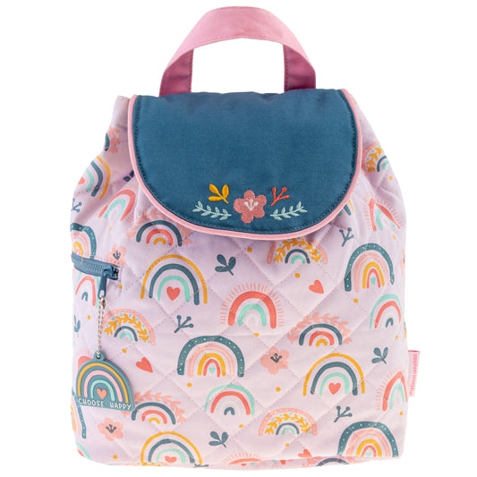 Quilted pink backpack with rainbow print, teal floral flap, top handle, side zipper and rainbow charm.