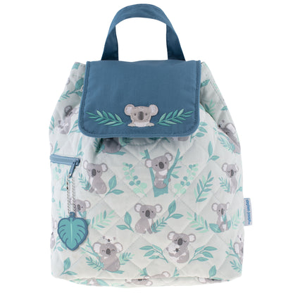 Quilted cream backpack with gray koalas, teal foliage, blue flap, embroidery, side zipper, and leaf charm.