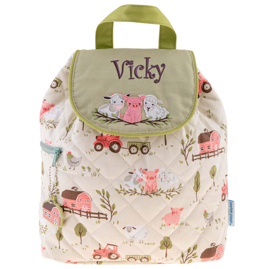 Cream quilted farm-print backpack with olive flap, embroidered barnyard animals and side zipper.