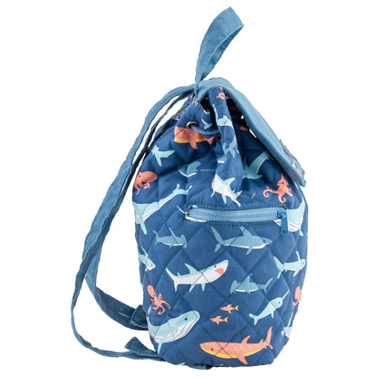Navy quilted drawstring backpack with colorful sea creatures, shoulder straps, and a front zip pocket.