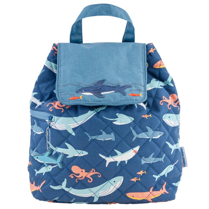 Quilted navy backpack with aqua and coral sea-life print, shark appliqué flap, top handle and shark zipper charm