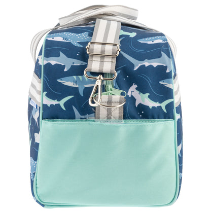 Blue shark-patterned duffle bag with mint green pocket and gray striped straps.