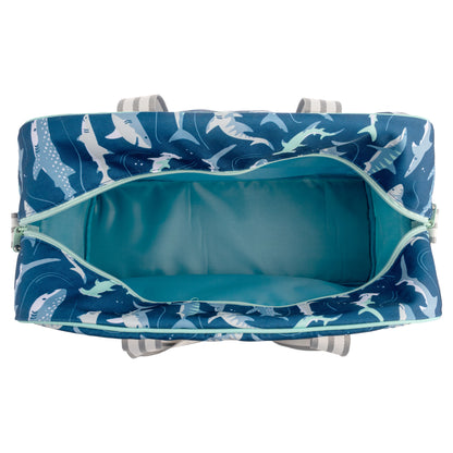 Blue duffle bag with shark pattern and teal lining, unzipped to show the inside.