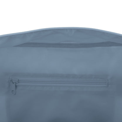 Interior view of a light blue duffle bag featuring a zippered pocket and mesh compartment.