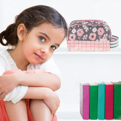Charcoal toiletry bag with pink and white floral pattern and pink checkered base, displayed on a shelf.