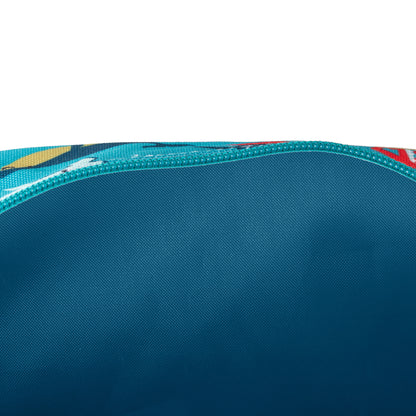 Inside view of a turquoise toiletry bag with a dark blue lining and a shark-patterned exterior.