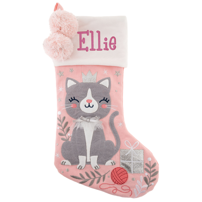 Pink stocking with embroidered name Ellie, featuring a gray cat wearing a crown, pom-poms, and a silver gift box.