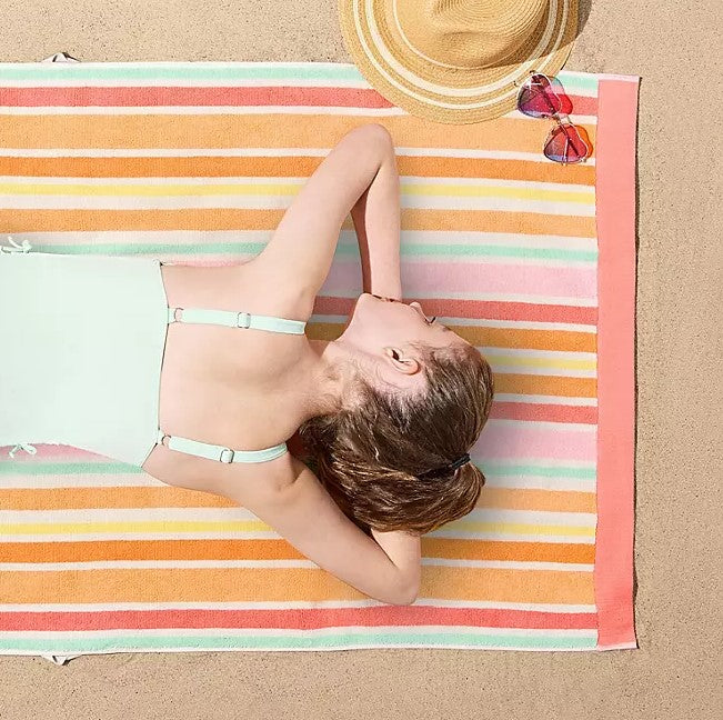Personalized coral striped Sunwash kids beach towel 30 x 60 inches detail view