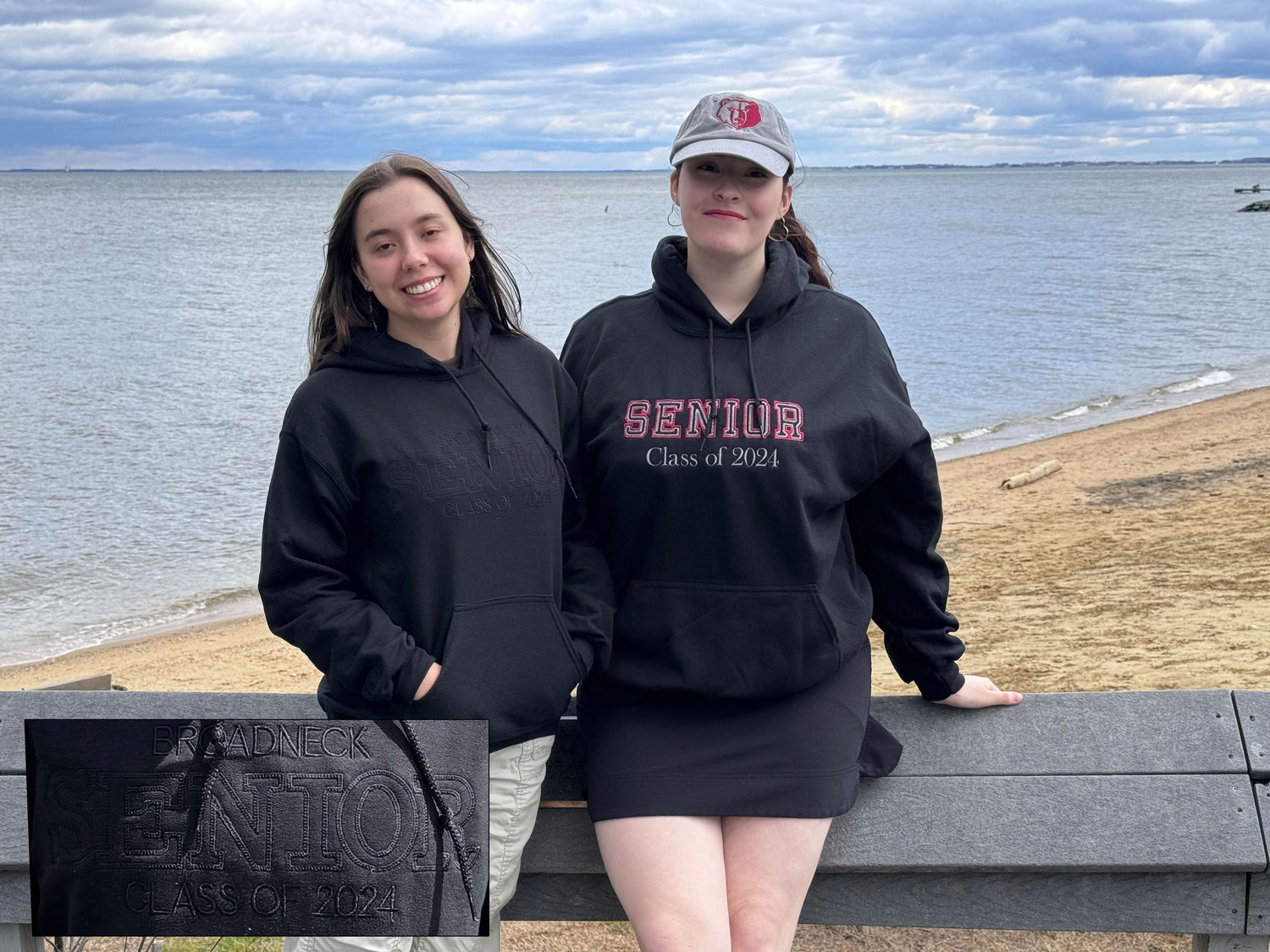 Two students wearing custom embroidered Broadneck Senior Class of 2024 hoodies at the beach