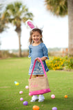 kid with pink burlap Easter baskets