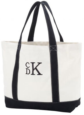 Cream tote with black handles and a black monogram