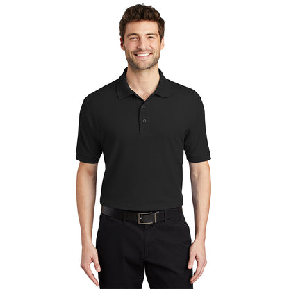 Man wearing a plain black short-sleeve polo shirt with a collar and button placket.