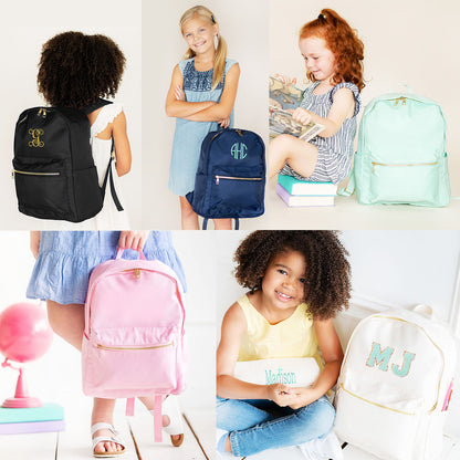 Collage of children with personalized Charlie backpacks in black, navy, mint, pink and cream
