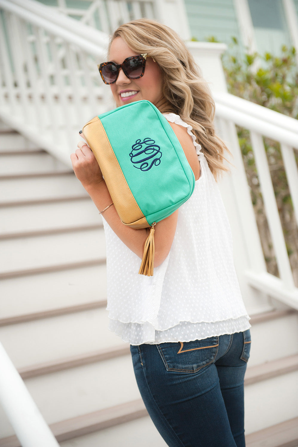 woman with mint cabana cosmetic bag