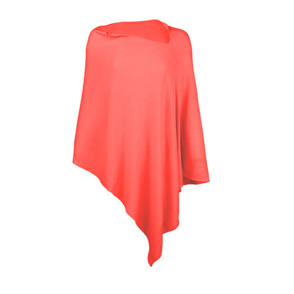 Coral Chelsea poncho with asymmetrical hem on a white background