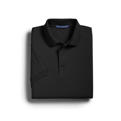 Black Port Authority Silk Touch polo shirt, neatly folded, showing collar and buttons.