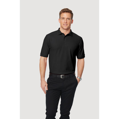 Man wearing a black Port Authority Silk Touch polo shirt with a collar and short sleeves.