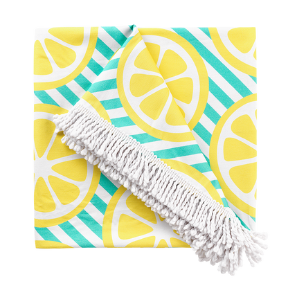 Close view of lemon-print blanket and white fringe