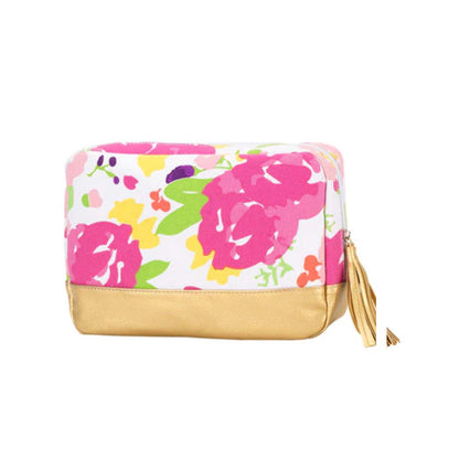 Pink floral Cabana cosmetic bag with gold-colored trim and tassel