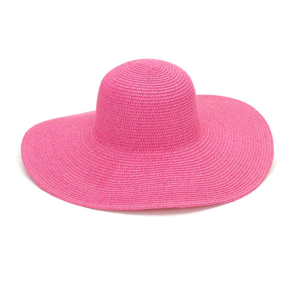 Pink wide-brim floppy hat on a white background