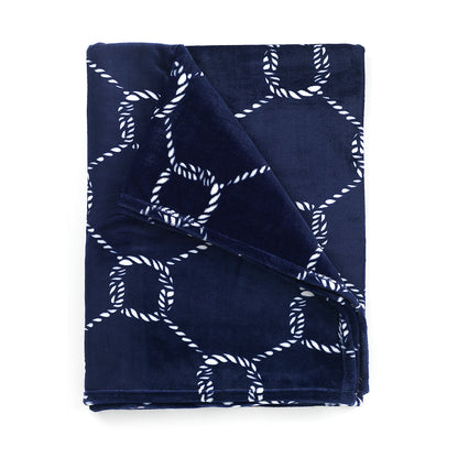 Folded navy blanket with white rope-knot pattern