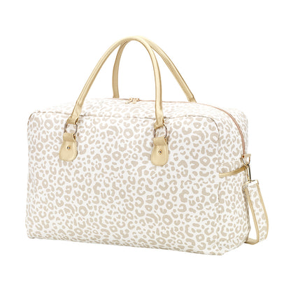 Cream leopard-print duffel with pale handles on a white background
