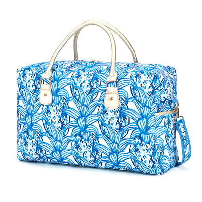 Blue tropical-leaf-print duffel with pale handles