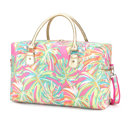 Pink and mint tropical-leaf-print duffel with pale handles