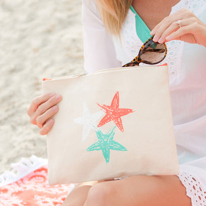 Woman holding a starfish pouch with sunglasses at its opening