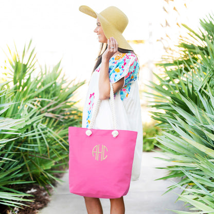Woman carrying a personalized hot pink rope-handle tote