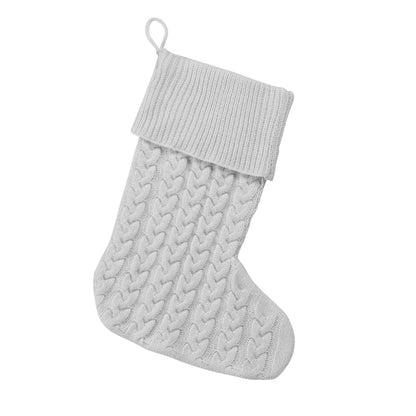 Grey cable knit Christmas stocking with folded ribbed cuff on white