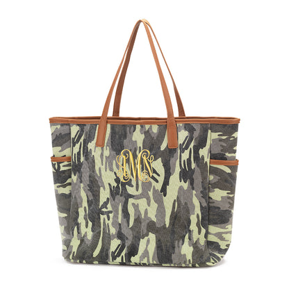Camouflage tote with tan handles and a yellow monogram