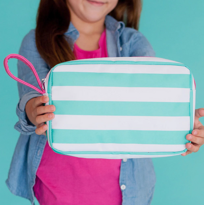 Child holding a mint and white striped cosmetic pouch
