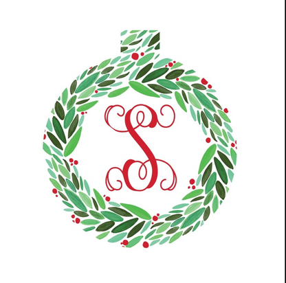 Round green leaf and red berry wreath ornament with red initial S on a white background