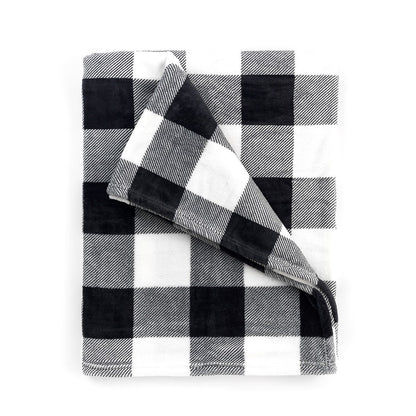 Folded black and white buffalo-check blanket